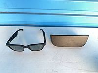 Sunglasses and case together on table