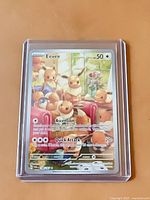 Front of Eevee #188 Pokémon card in protective case