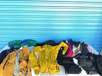 Full spread of all children’s garments laid out for overview