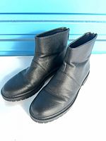 Side view of both boots displaying texture and shape