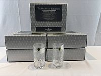 Five Millennium Collection boxes and two loose Waterford Hiball glasses showing stickers