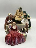 Group shot of all four Royal Doulton figurines