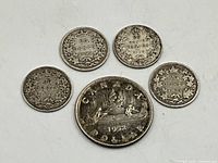 Reverse sides showing wreath and voyageur designs