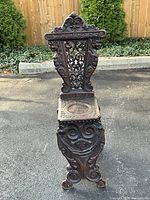 Full front view of carved walnut sgabello chair