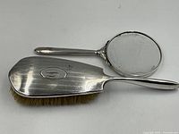 Hairbrush and hand mirror front view