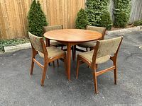 Dining set – round teak table and four chairs