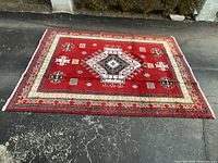 Full view of rug showing overall design and condition