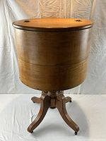Full view of oak cylindrical wine cooler with lid closed