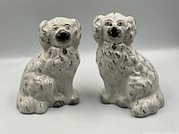 Front view of both Staffordshire spaniel figurines