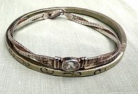 Both bracelets side by side showing crystal and bangle details