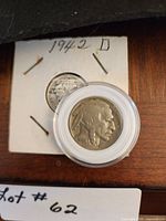 Buffalo nickel in capsule front of Mercury dime in flip, showing coin details and year labels