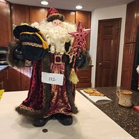 Front view of Santa figurine standing on counter