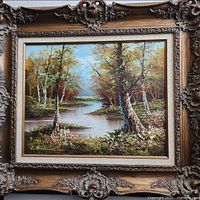 Frontal view of framed painting showing full artwork and ornate frame