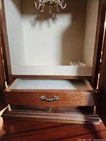 Interior showing carousel hooks, drawer, felt lining