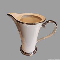 Full view of Lenox bone china coffee pot, showing spout, handle, platinum trim, and absence of lid