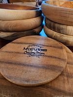 Stacked myrtlewood bowls with branded underside visible