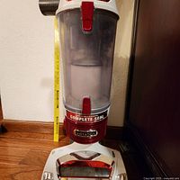 Full front view of Shark Rotator vacuum showing base, dust cup, Rotator branding