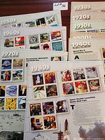 Multiple Celebrate the Century stamp sheets for 1950s, 1970s, 1980s, 1940s, 1920s visible