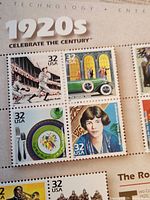 Portion of 1920s Celebrate the Century sheet showing four 32¢ stamps (Babe Ruth, 1920s automobile, Art Deco china, flapper portrait)