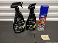 Two Turtle Wax Jet Black Spray Detailer bottles and one Gunk Engine Protector Shine can