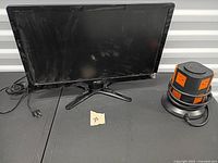 Front view of Acer monitor and power distribution tower on table
