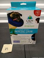 Front of Calm Paws Protective Collar box showing product image and medium size details