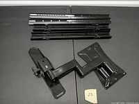 Flat screen wall mount components including articulating arm and mounting rails