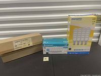 Three boxed bulb packs: Everett Electric, EcoSmart, Energetic