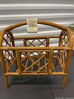 Natural rattan magazine holder with arch handle and lattice weave sides