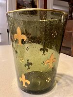 Front view showing green bubble glass and gold fleur-de-lis pattern
