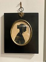 Front view of framed silhouette portrait