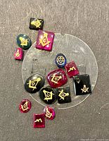 Group of loose Masonic stones on measuring disk