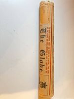 Full rolled newspaper in original wrapper