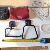 All items laid out with tape for scale