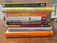 Stack of eight books showing spines