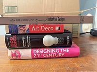 Stack showing spines of all four design books