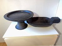 Pedestal platter and carved bowl side by side