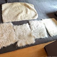 Five sheepskin pieces laid out, showing sizes and textures
