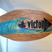 Top view of skimboard showing graphic and brand