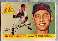 Front of 1955 Topps Harvey Haddix card showing portrait, action pose, logo and name bar