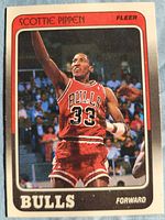 Front of 1988 Fleer Scottie Pippen card showing action photo, Bulls jersey number 33, name banner, team and position