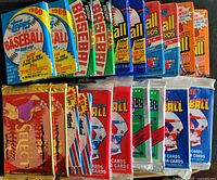 All 20 sealed baseball card packs arranged in rows showing front wrappers and brands