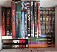 Box showing upright row of DVD sets with titles visible