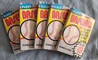 Five sealed 1989 Fleer baseball card wax packs displayed front side