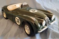 Front three-quarter view of green #38 Jaguar XK120 model