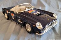 Front three-quarter view of blue Ferrari 250 GT California model