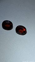 Both oval spessartite garnets side by side
