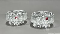 Pair of clear textured glass tealight holders with Iittala logo front view
