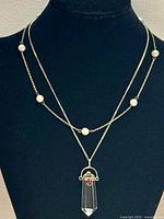 Both necklaces displayed on bust