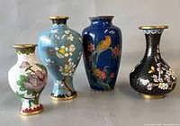 Front view of four cloisonné vases showing motifs
